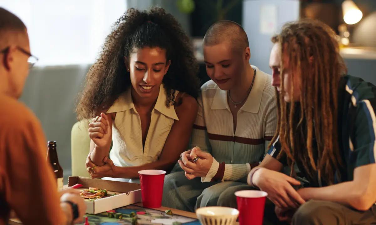 Friends gathered around a tabletop game