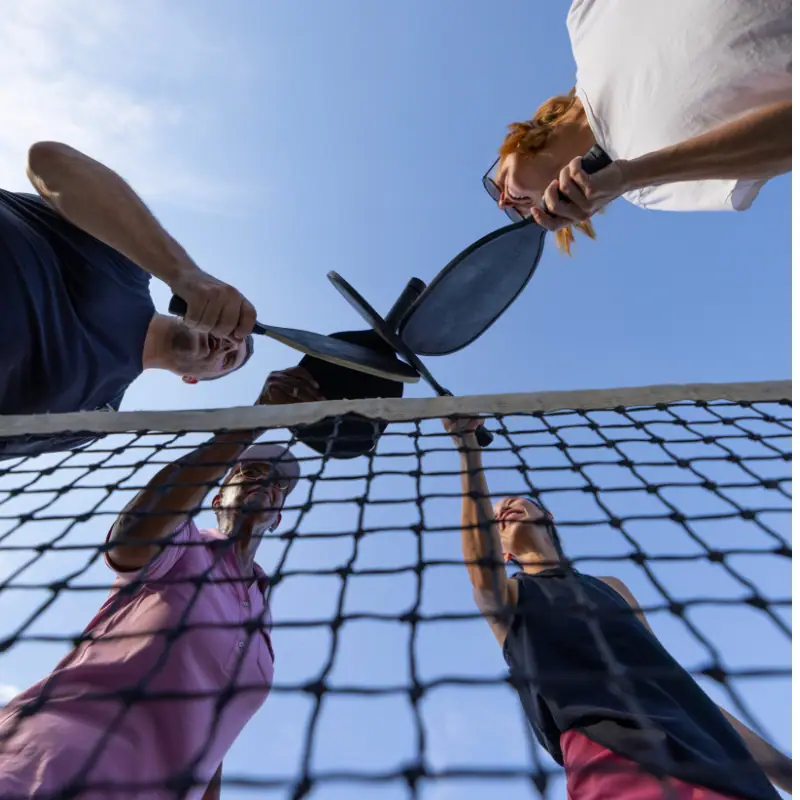 Neighbors playing pickleball at a local court