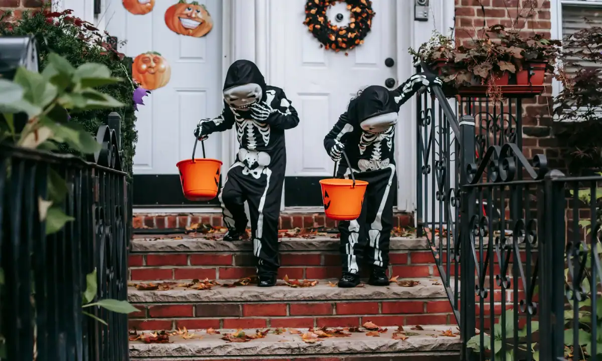 Neighbors enjoying a trick-or-treat tradition