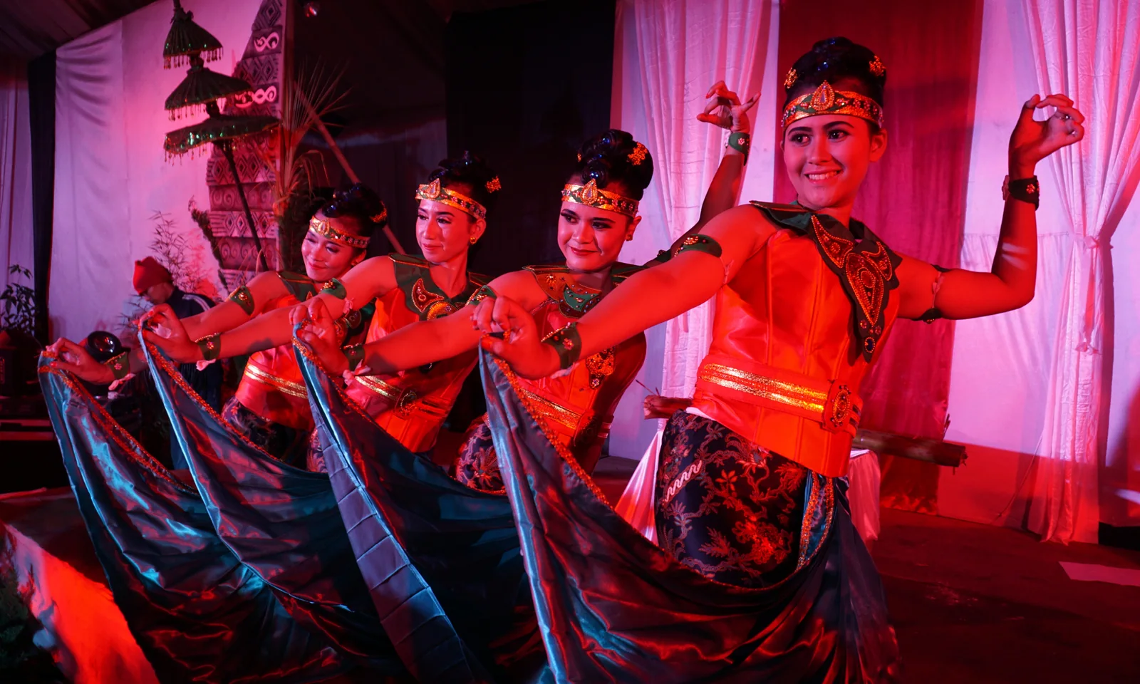 A group of dancers performing in colorful costumes.